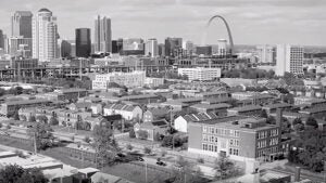 Aerial shot of St. Louis buildings and Arch